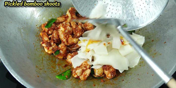 Add the boiled pickled bamboo shoots and a little water.