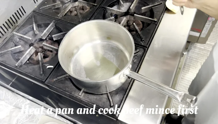 Add the beef to the wok and stir-fry until browned. Make sure to break up any clumps of beef.