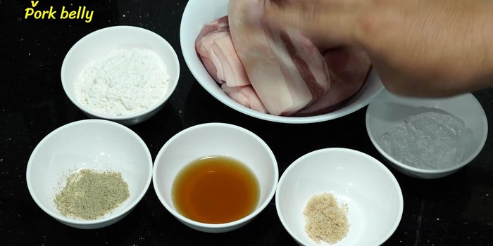 Cut the pork belly into strips, then into larger pieces.