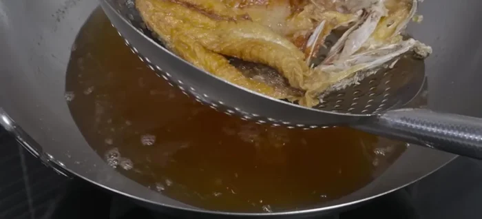 Remove the sea bass from the pan and set aside to cool.