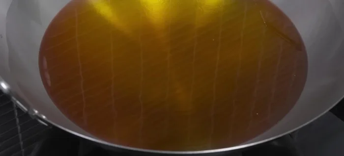 Heat a pan with oil until very hot (around 200°C).