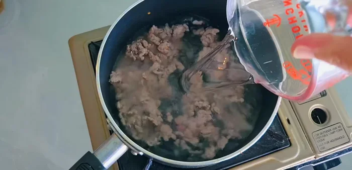 Add water, seasoning powder, soy sauce, and oyster sauce. Bring to a boil.
