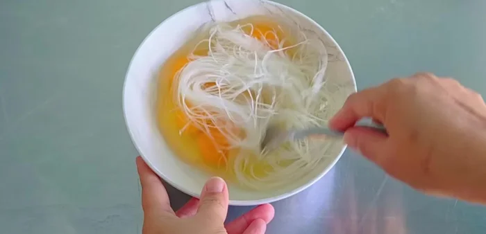 Soak glass noodles in water until softened.