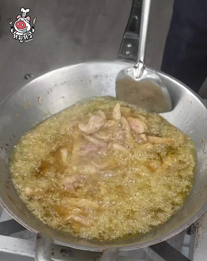 Fry the pork until cooked through.
