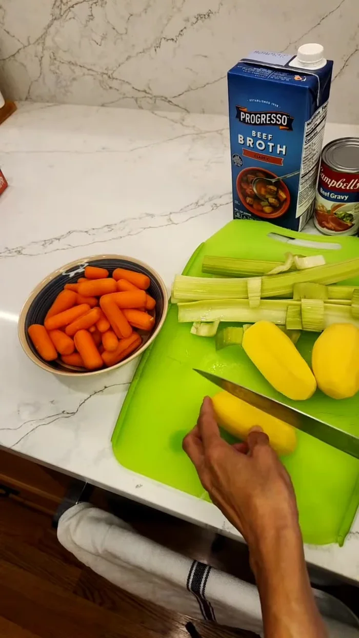 While the beef stews, prepare the potatoes, carrots, and celery by cutting them into small pieces.