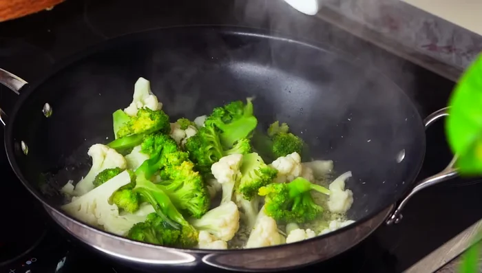 Add cabbage, beans, and carrots; stir-fry.