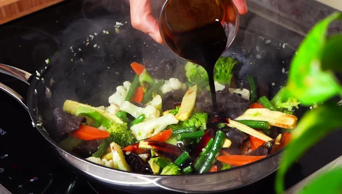 Stir in the sauce base. Once it bubbles, add the cornstarch mixture to thicken.