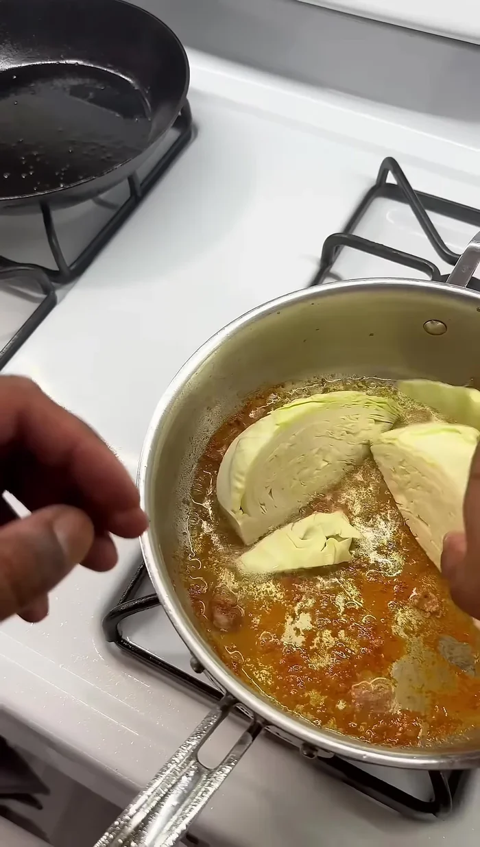 Add cabbage to the pan and cook in the chicken fat.