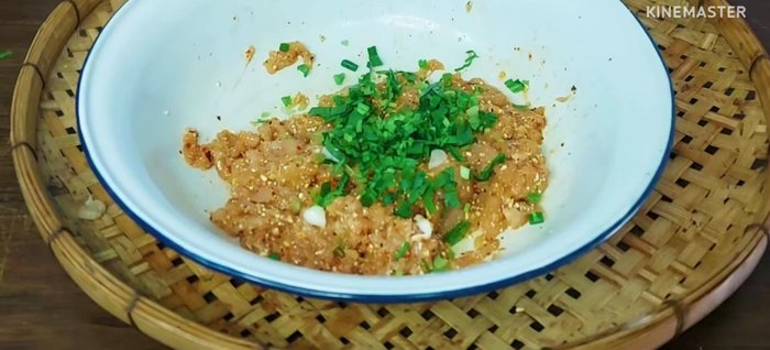 Add chopped shallots, coriander, and parsley to the chicken mixture.