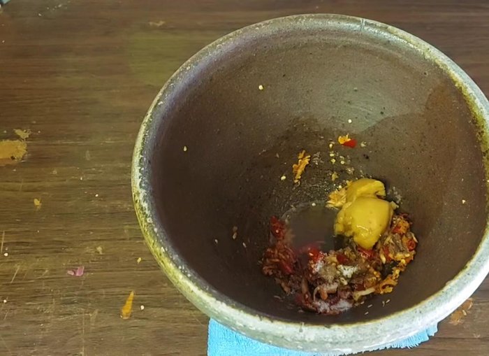 Add warm water if the mixture is too thick. Taste and adjust the seasoning as needed (fish sauce can be added for saltiness).