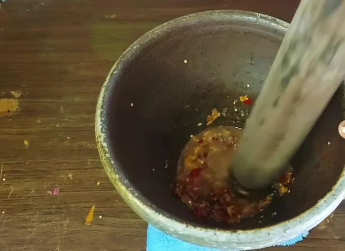 Continue to pound the mixture until all ingredients are well combined and the coconut sugar is dissolved.