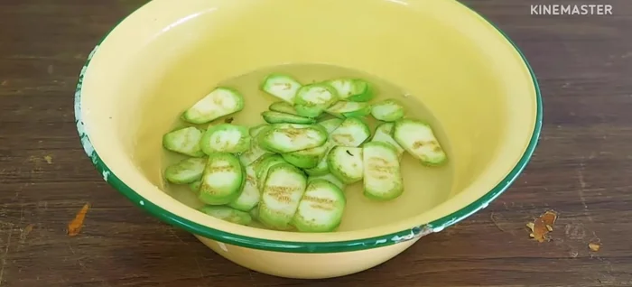 Soak the cut eggplant in salted water to evenly distribute the salt and prevent bitterness.