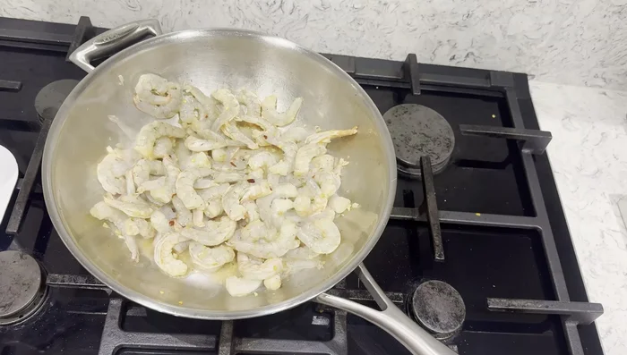 Stir-fry prawns with ginger, garlic, and the Fire Prawn Cracker sauce.