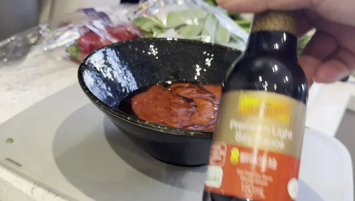 Prepare the Fire Prawn Cracker sauce: Combine oyster sauce, sriracha sauce, honey, soy sauce, hot chilies, ketchup, and rice vinegar. Mix well.