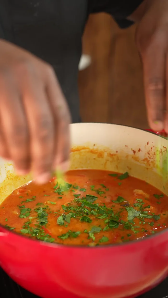 Garnish with cilantro, Thai basil, and jalapenos.
