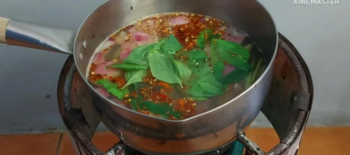 Just before turning off the heat, add basil, spring onions, and coriander. Squeeze in some fresh lime juice to enhance the flavor.