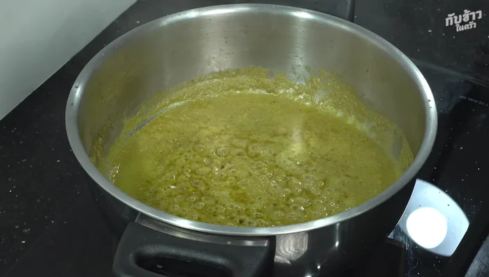 Simmer until coconut milk starts to separate. Season with palm sugar, salt, and fish sauce to taste.