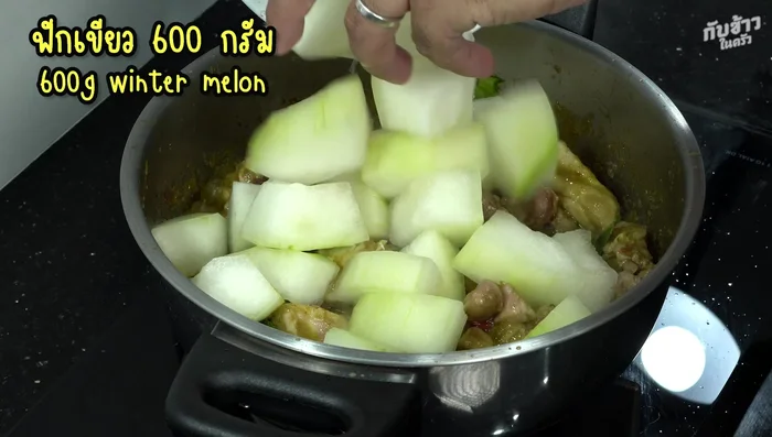 Add green pumpkin. Pour in more coconut milk to cover the pumpkin.