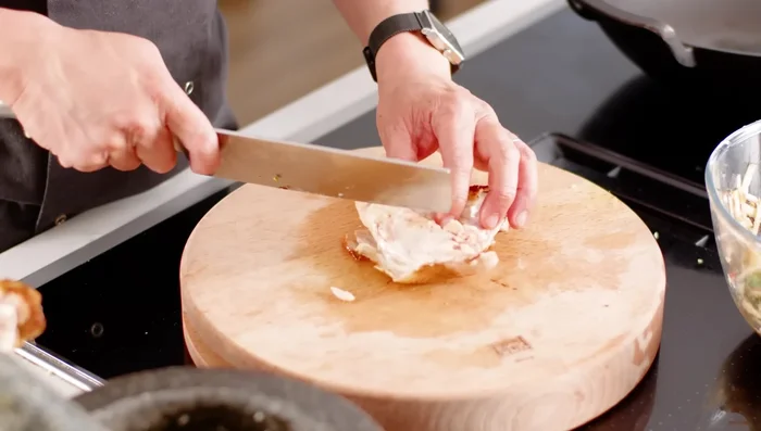 Add the cooked chicken thigh (and/or leg), sliced into bite-sized pieces. Gently toss to combine.