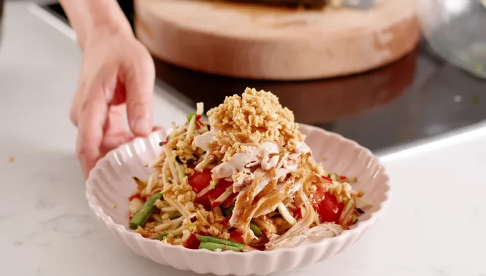 Garnish with crushed peanuts.