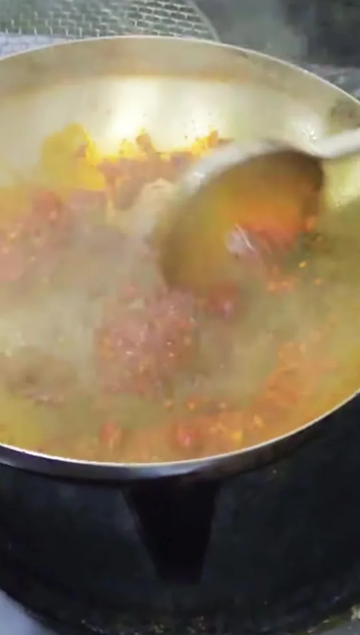 Add Thai roasted chili paste and water; simmer until glazed.