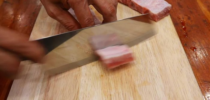Prepare the pork ribs. (Assuming this step is implicit, details needed from video)
