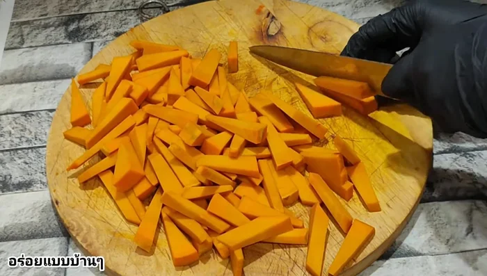 Cut the pumpkin into bite-sized triangles.