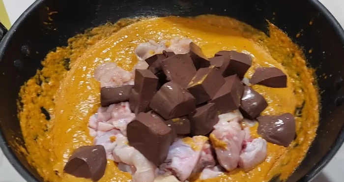 Add the chicken and chicken blood. Adjust heat to medium or high.