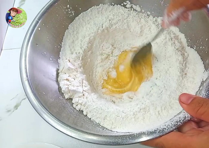 Make a well in the center of the flour and gradually add the liquids. Mix until well combined using a spoon.