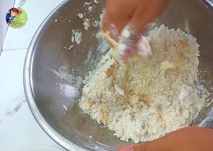 Use your hands to knead the dough until smooth. Gradually add melted margarine (or oil). Continue kneading until soft and smooth.