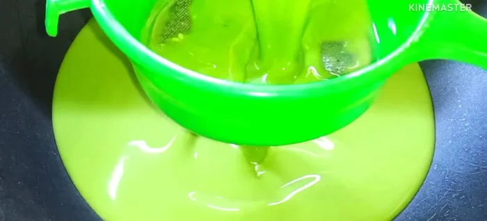 Pour the batter through a sieve into a non-stick pan. Add 2 tablespoons of vegetable oil.