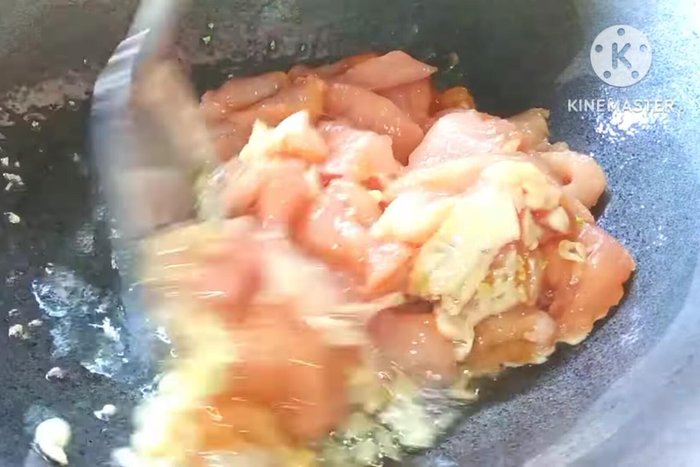 Add the marinated chicken and stir-fry until cooked.