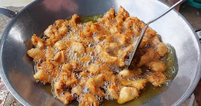 Check for crispiness by tapping the chicken skin with a spatula (it should make a crunchy sound).