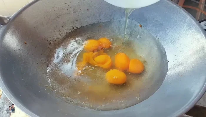 Add 600ml of water to the pan. Pour the egg mixture into the pan. Cover with a steamer lid or pot lid.