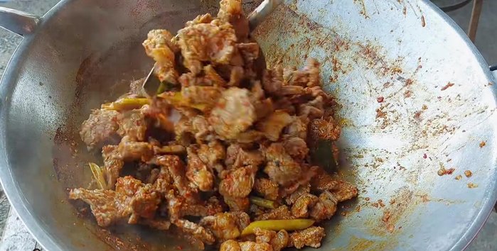 Continue to stir-fry until the water dries up. This will create a rich and fragrant curry.