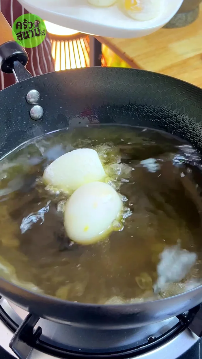 Heat oil in a pan. Add eggs and fry until golden brown and crispy using medium heat.