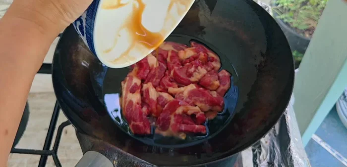 Add the pork to the pan, spreading them apart and using low heat.