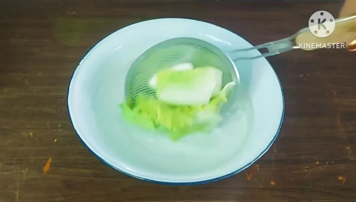 Immediately transfer the blanched cabbage to cold or room temperature water to stop the cooking process.