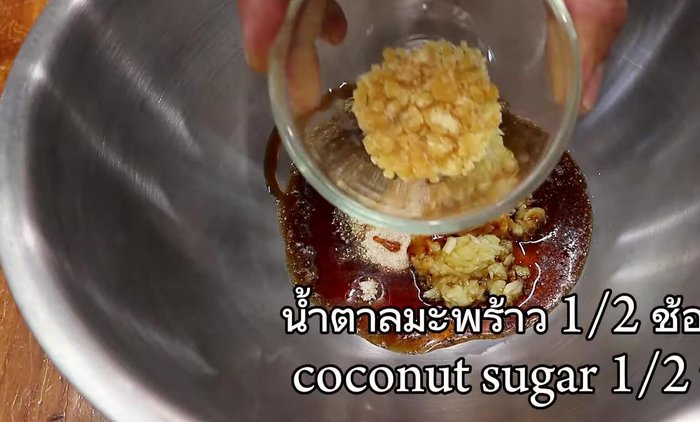 Heat cooking oil in a pan. (This step is implied and not explicitly stated in the transcript.)