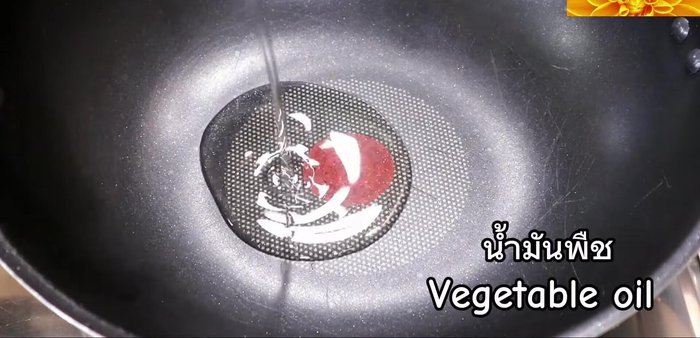 Heat oil in a wok or large frying pan.
