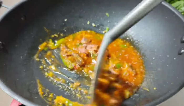 Add the chopped Chinese kale to the pan.