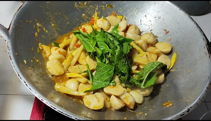 Stir-fry until everything is well blended. Add basil leaves and stir-fry until wilted and fragrant (don't overcook).