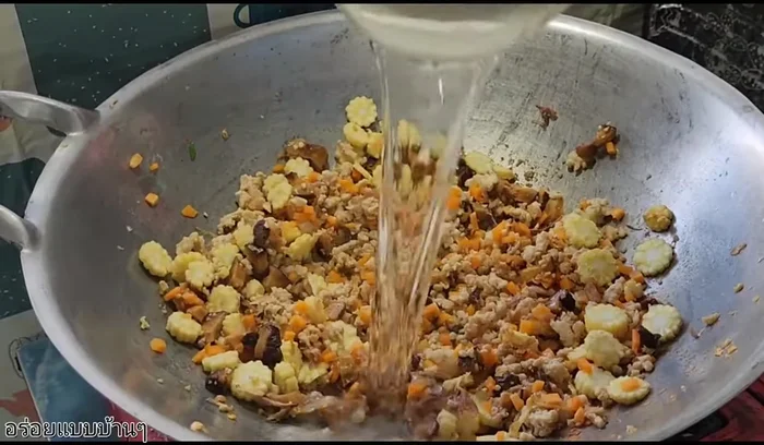 Add water and continue stir-frying until vegetables are tender.