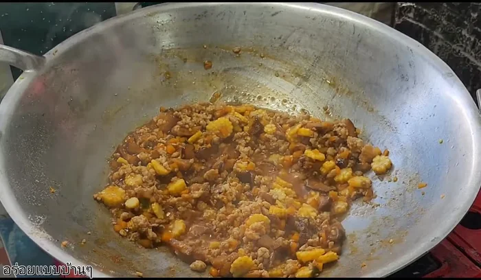 Add chopped spring onions and stir-fry briefly.