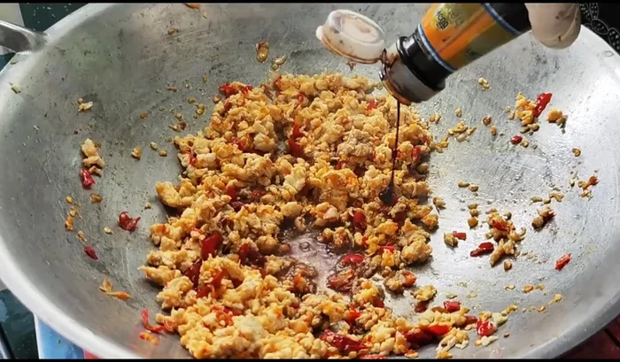 Add soy sauce (light and dark), oyster sauce, sugar, and pepper. Stir-fry until well combined.
