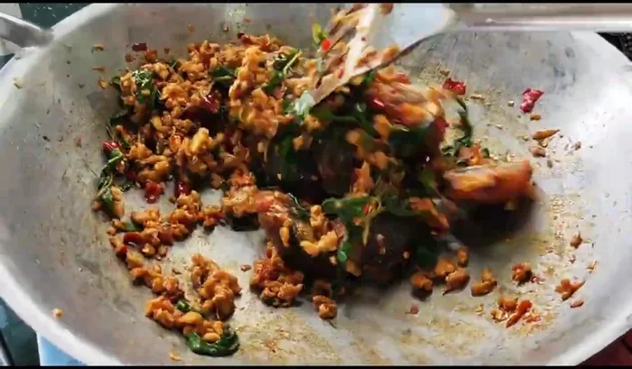 Add the fried century eggs and stir-fry until all ingredients are well combined. Do not overcook.