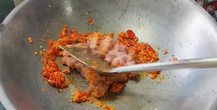 Add the minced pork and stir-fry until cooked.