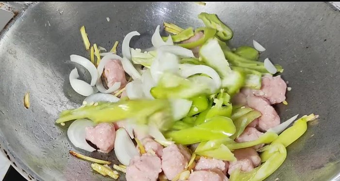 Add bell peppers, onions, and chives.