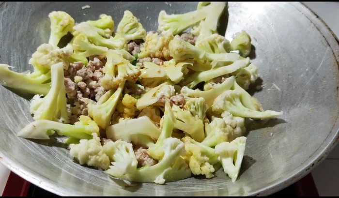 Add light soy sauce, oyster sauce, and a little sugar. Stir-fry until well combined.