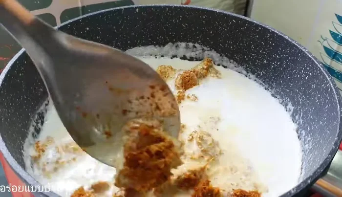 Add the southern curry paste and stir until the coconut milk separates further.